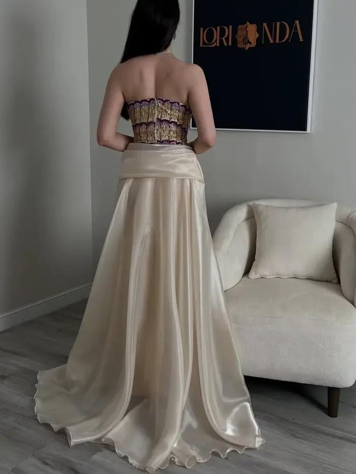 Jupe longue plissée en satin pour femme