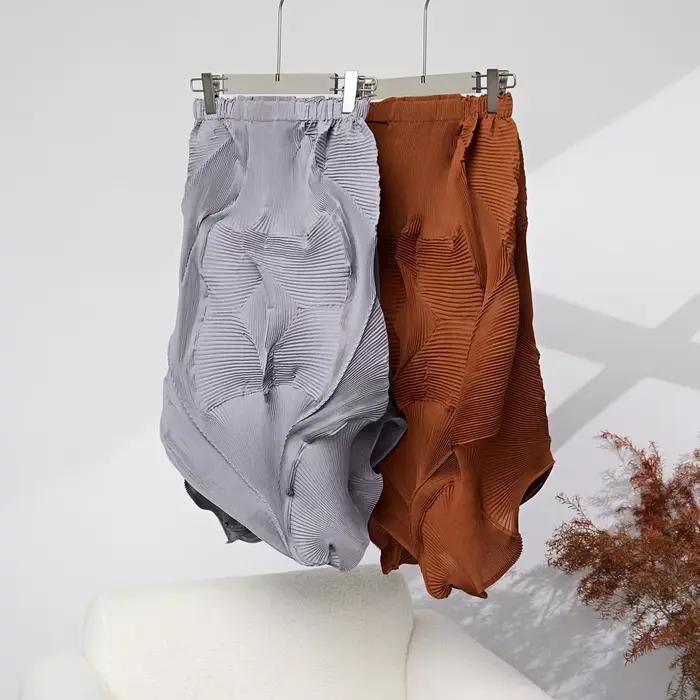 Miyake plissé couleur unie demi-jupe 2025 été nouvelle jupe demi-corps plissée irrégulière femmes mi-longue bourgeon