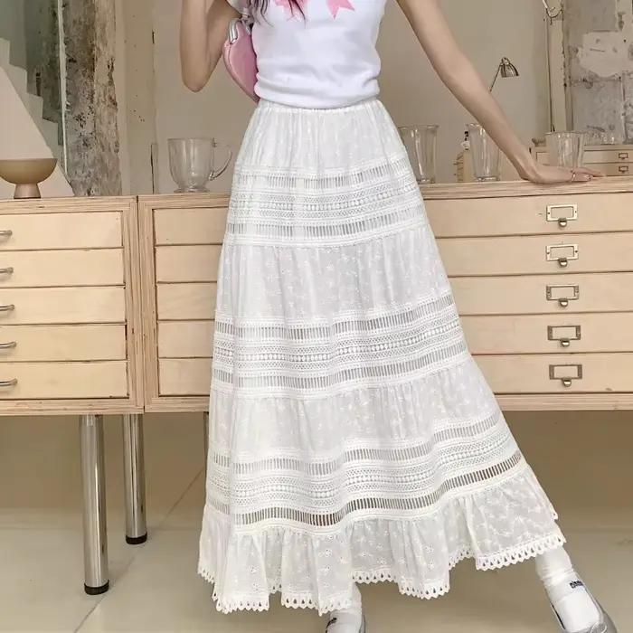 Jupe longue maxi brodée à œillets et découpes en coton blanc semi-transparente fluide pour femme
