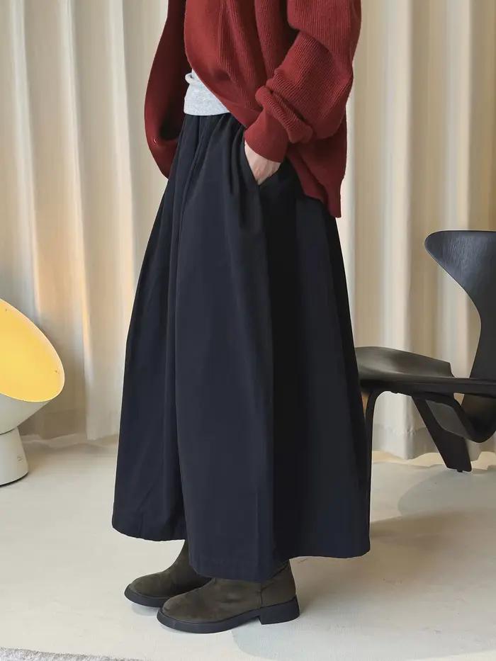 Début du printemps simple taille haute bouton élastique demi-jupe ample minceur décontracté jupe longue pour les femmes