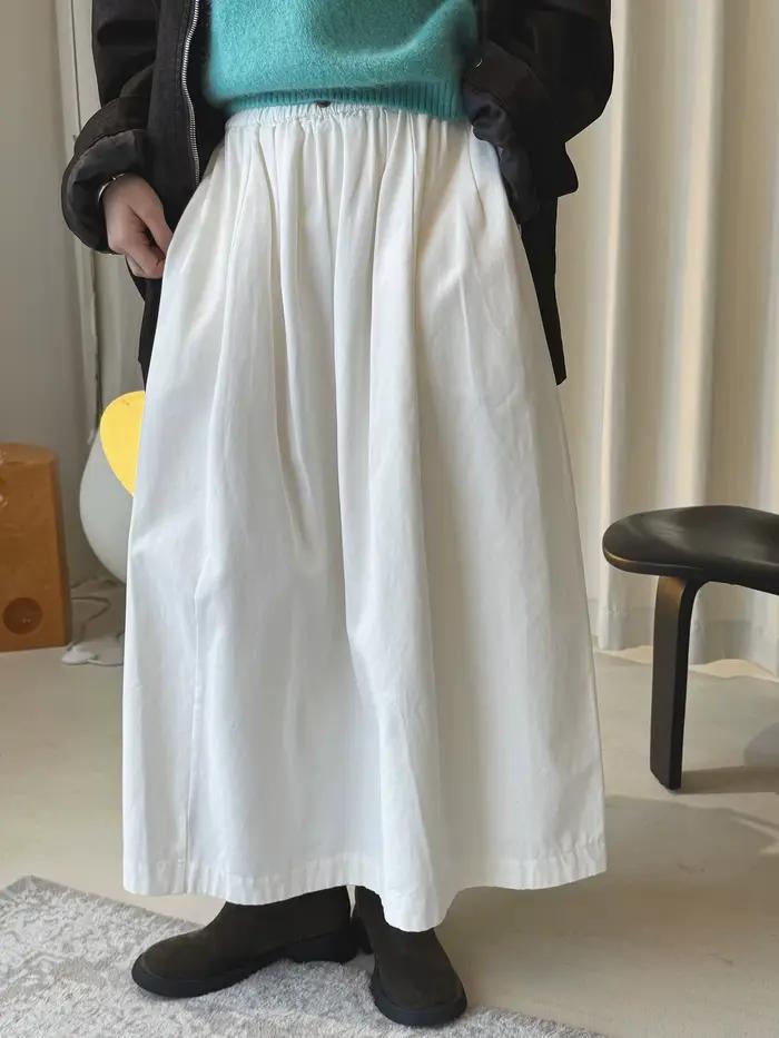 Début du printemps simple taille haute bouton élastique demi-jupe ample minceur décontracté jupe longue pour les femmes