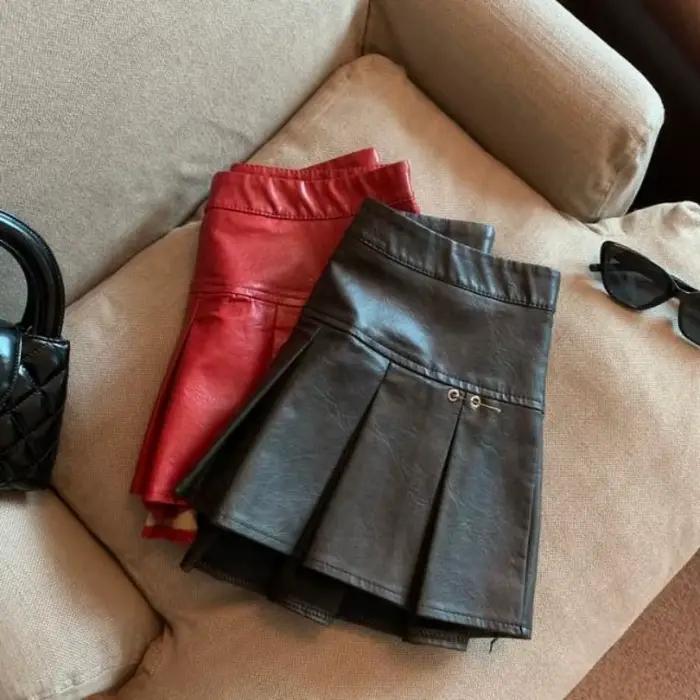Jupe plissée en cuir PU américain pour femmes