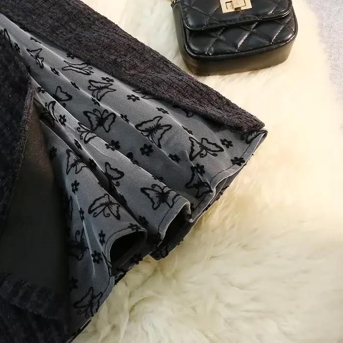 Jupe mi-longue noire papillon pour femme