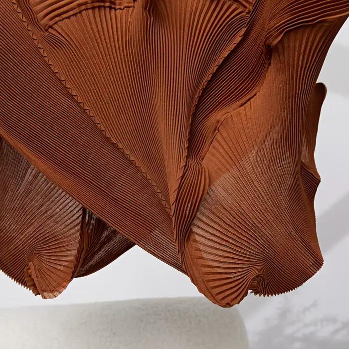 Miyake plissé couleur unie demi-jupe 2025 été nouvelle jupe demi-corps plissée irrégulière femmes mi-longue bourgeon