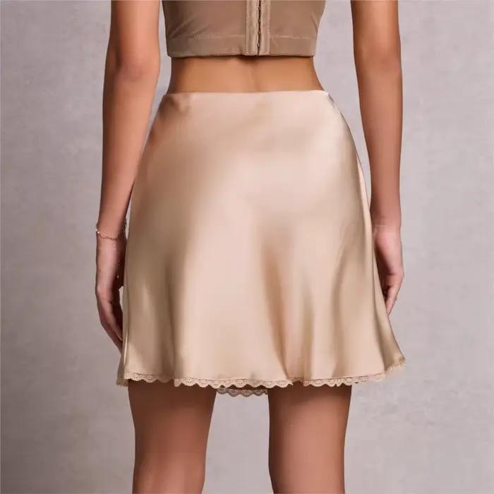 Nouvelle jupe courte évasée en dentelle sexy et élastique à taille haute pour femmes