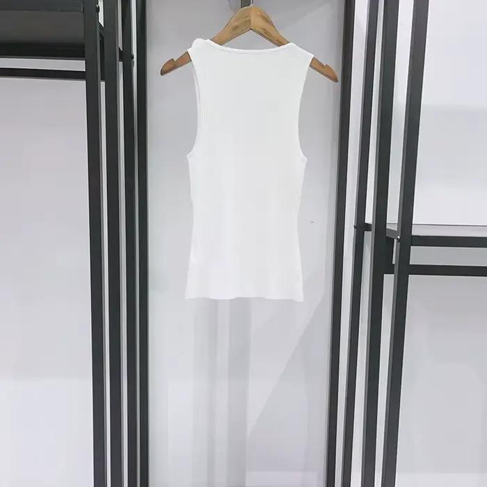 Jupe asymétrique à volants irréguliers pour femme ou gilet en maille ajusté à col en U avec garniture florale tridimensionnelle Printemps-Été 2026