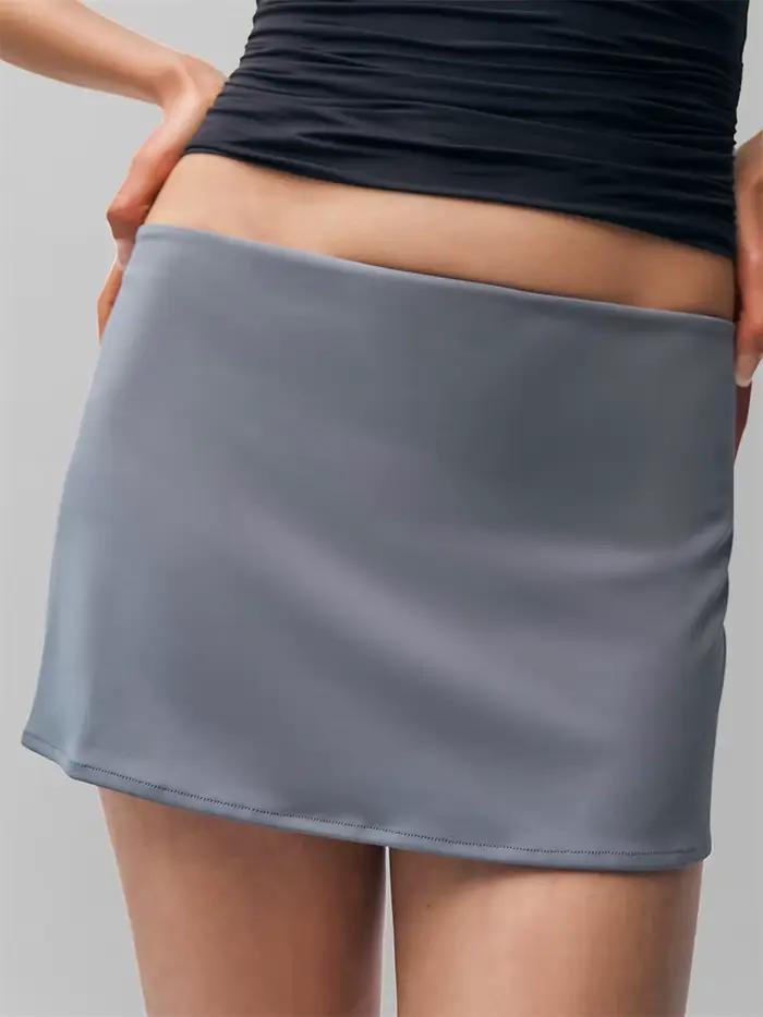 Taille basse à la mode élastique mince Mini Micro jupe a-ligne couleur unie