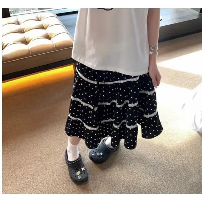 Jupe noire à pois avec dentelle et taille élastique, doublée