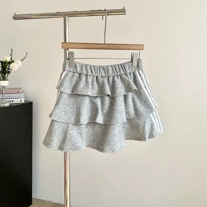 Jupe courte rayée douce polyester été 2026 anti-exposition bouffante ajustement parfait femmes occasions spéciales