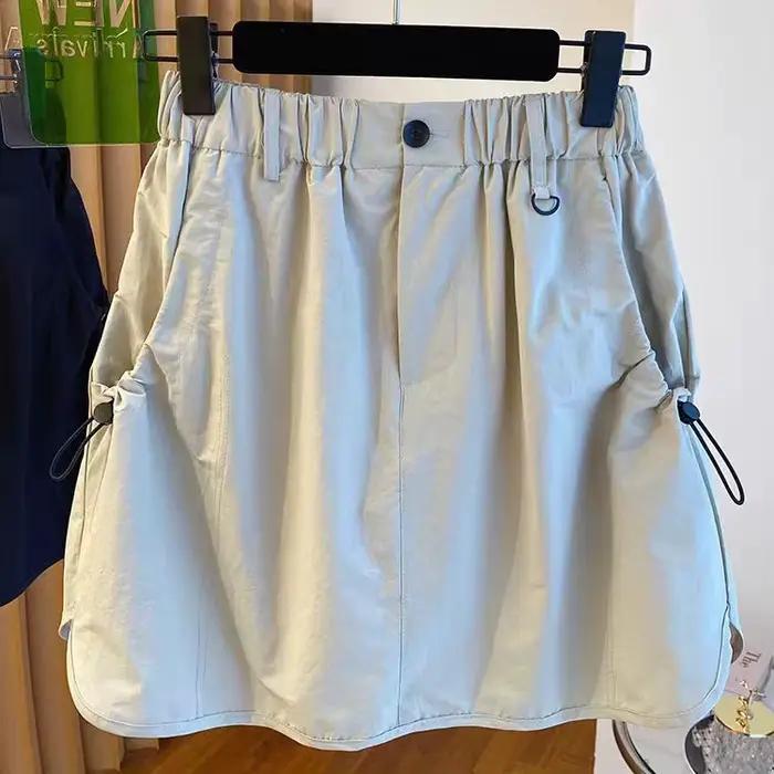 Version coréenne vêtements de travail jupe courte ample taille haute rétro décontracté tendance demi