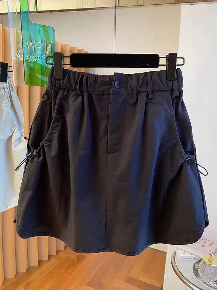 Version coréenne vêtements de travail jupe courte ample taille haute rétro décontracté tendance demi-longueur