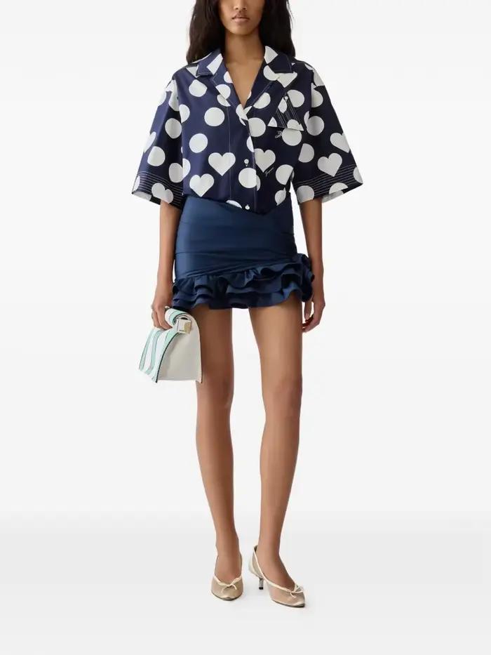 Jupe mini asymétrique à volants noués en satin bleu marine taille haute