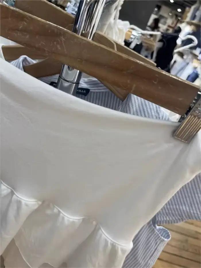 Mini-jupes blanches à volants étagés pour femmes