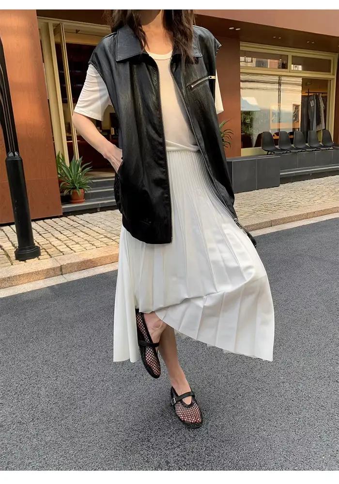 Jupe mi-longue polyvalente en simili cuir plissé
