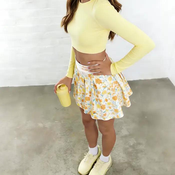 Mini-jupe plissée jaune imprimée taille haute pour femme