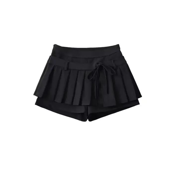 Mini-jupe plissée taille haute avec nœud papillon