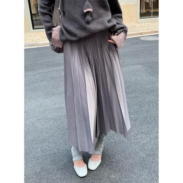 Jupe mi-longue polyvalente en simili cuir plissé