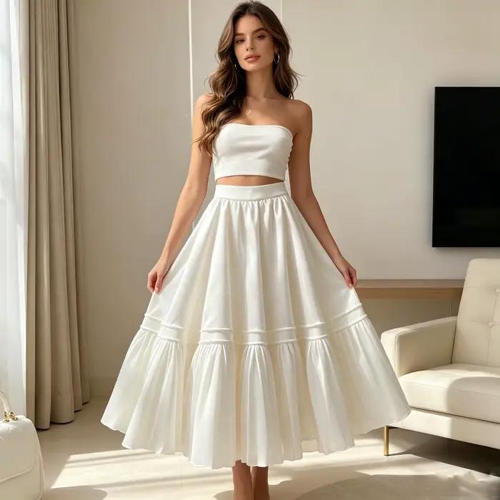 Jupe longue plissée évasée taille haute en satin blanc pour femme