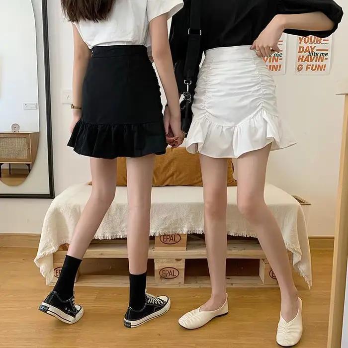 Jupe courte plissée taille haute polyvalente pour femme