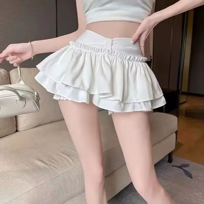 Jupe plissée bouffante Anti-culotte Flash Skort Ballet Academy Style Mini jupe évasée mignonne pour femmes Design superposé jeune