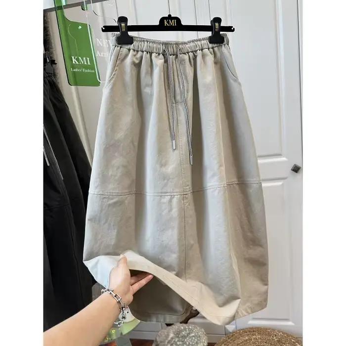 Jupe parapluie mi-longue élégante et polyvalente à taille élastique pour femme