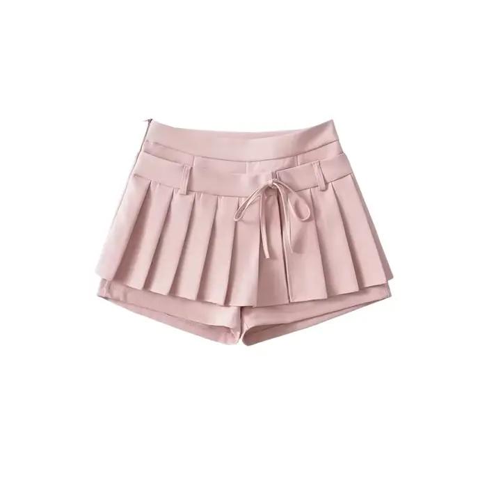 Mini-jupe plissée taille haute avec nœud papillon