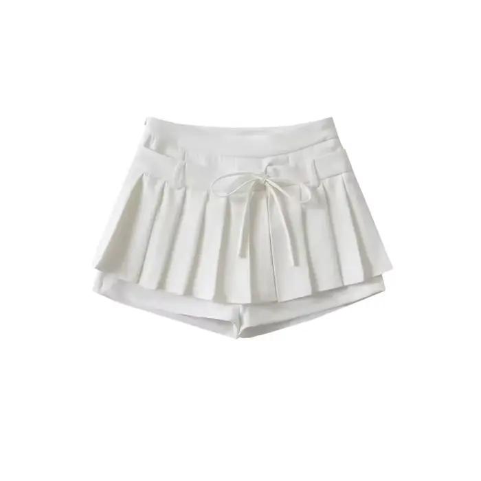 Mini-jupe plissée taille haute avec nœud papillon