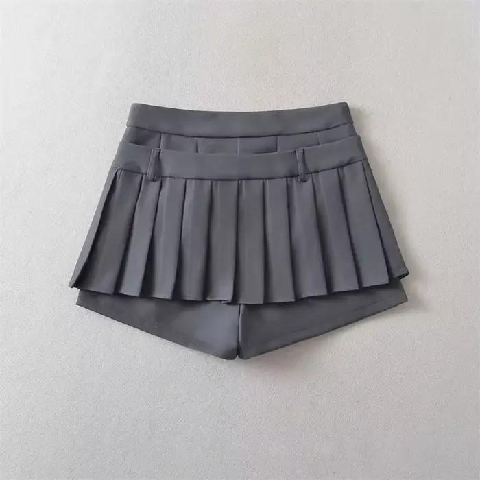 Mini-jupe plissée taille haute avec nœud papillon