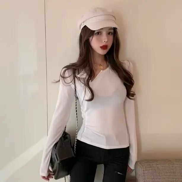T-shirt moulant à manches longues et col incliné pour femme